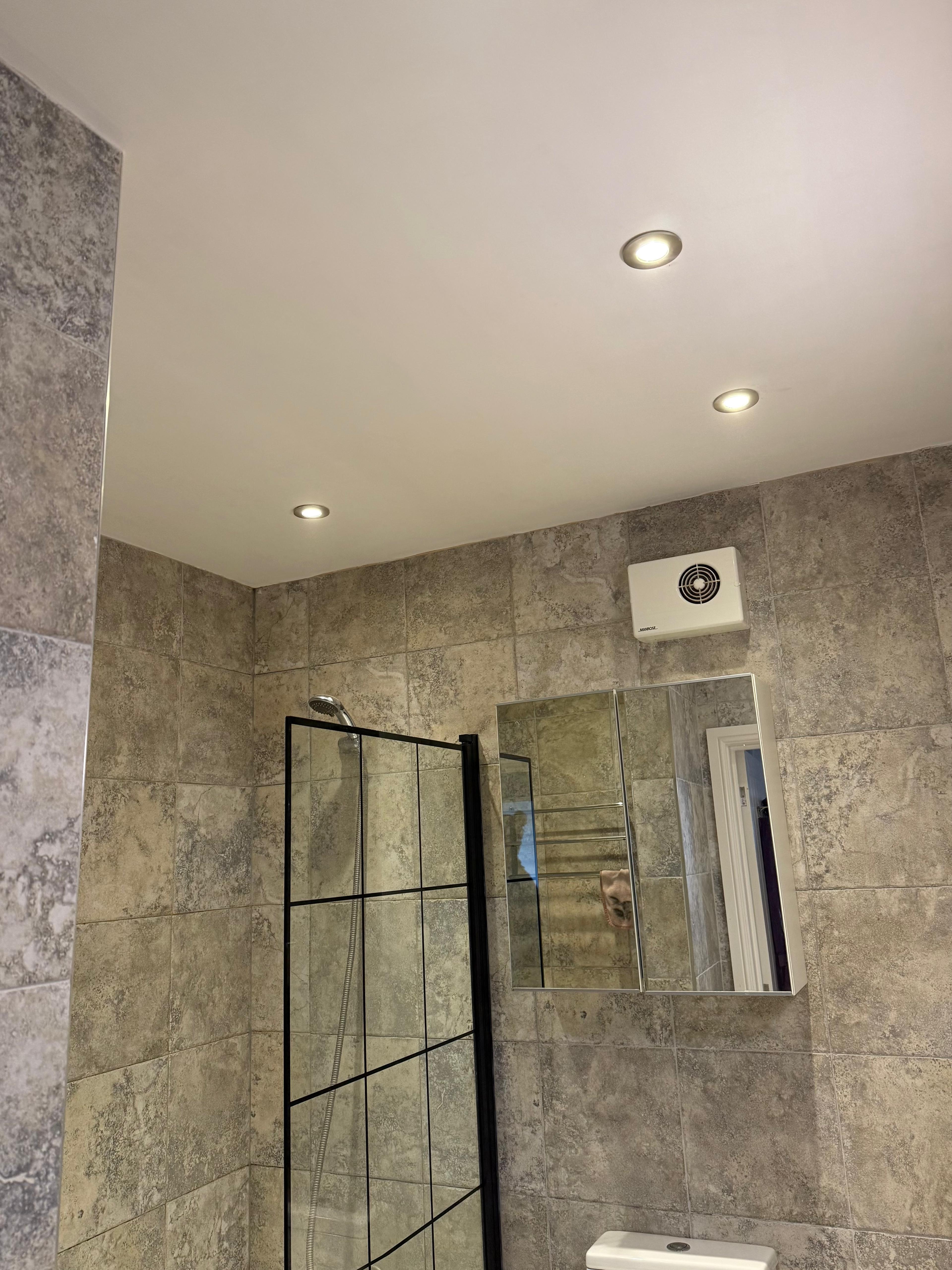 Recessed downlights installed in a tiled bathroom, Bristol