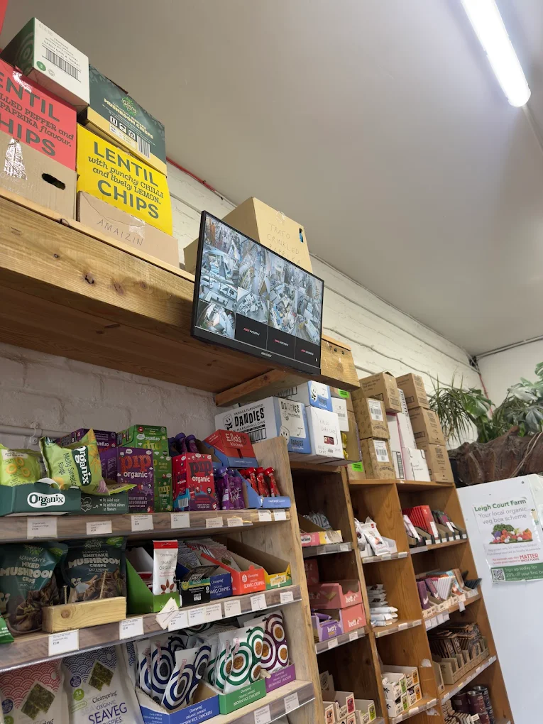 CCTV monitoring screen installed on retail shop shelving in Bristol