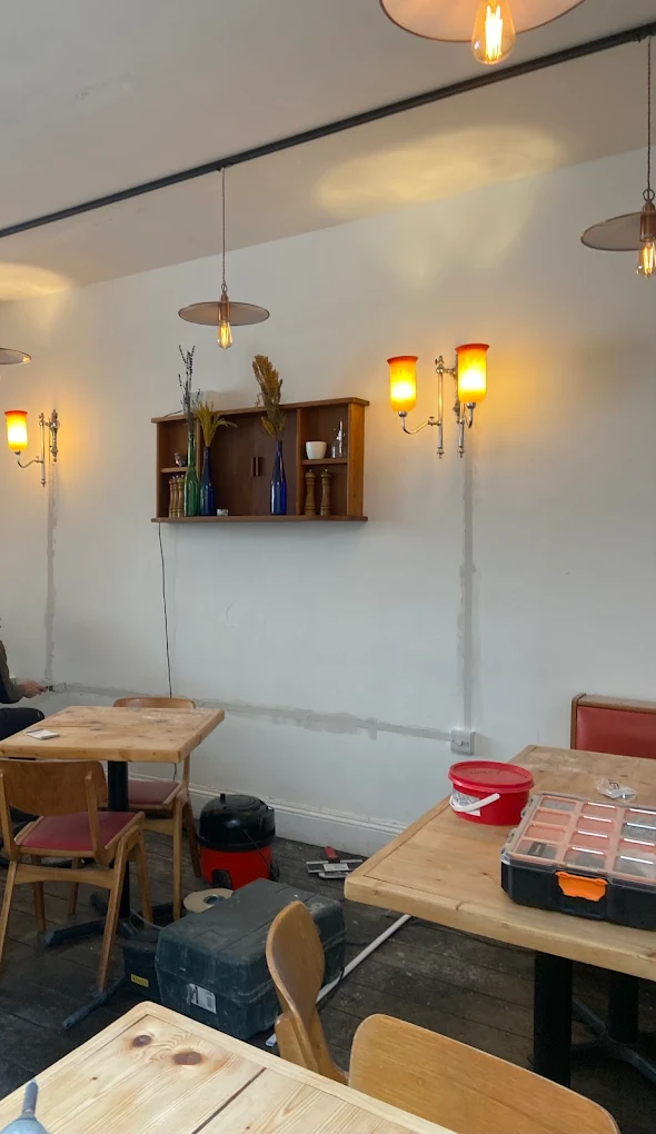Wall sconces and pendant lights in a Bristol café