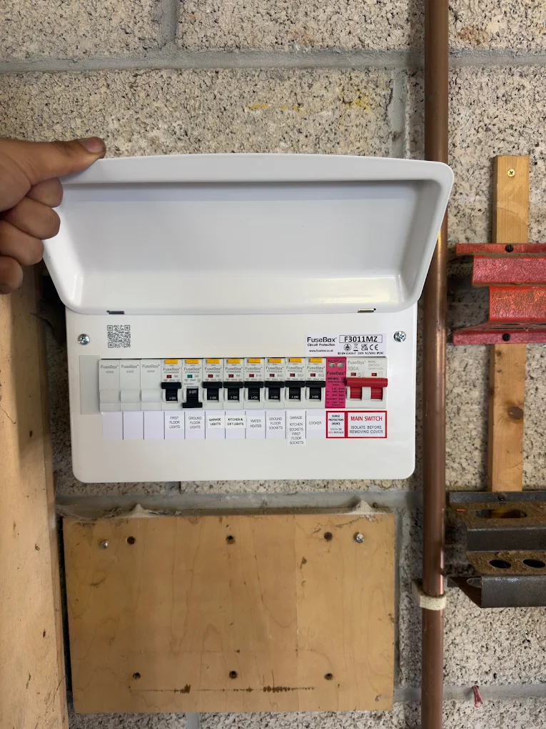 FuseBox consumer unit with cover lifted showing clean wiring, Bristol