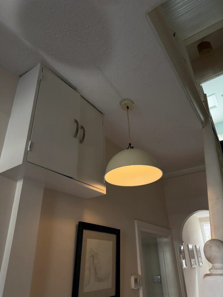 Pendant light fitting installed in a residential hallway in Bristol