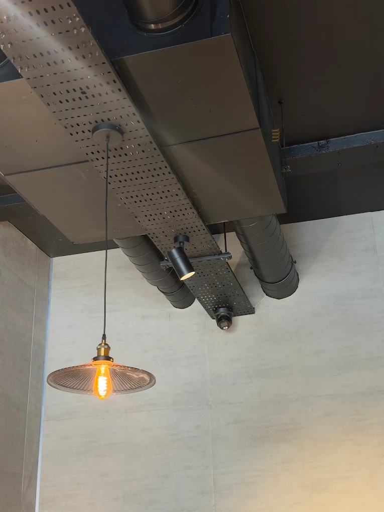 Industrial-style pendant light installed in Bristol commercial space