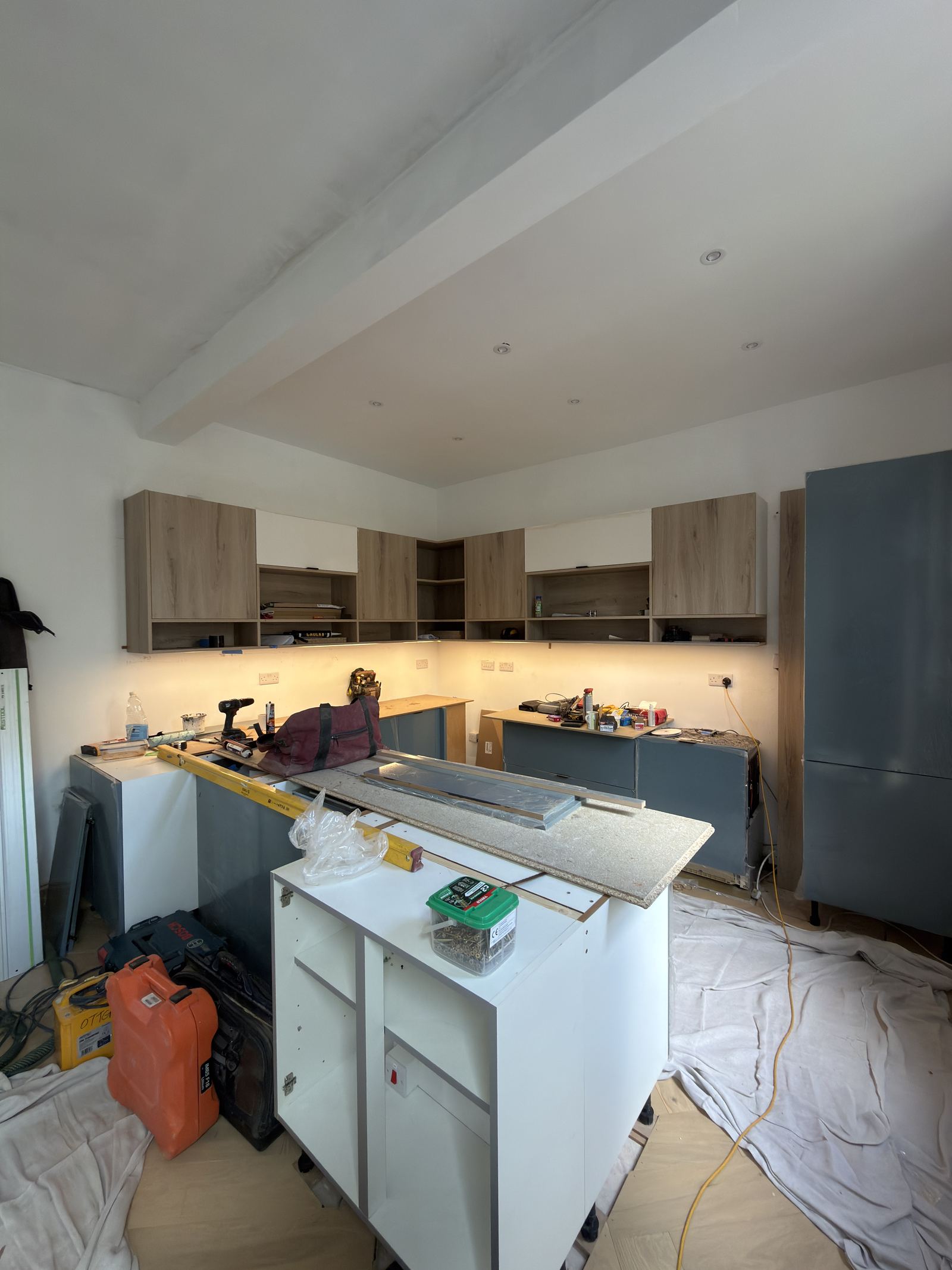 Recessed ceiling downlights and under-cabinet LED lighting installed in a Bristol kitchen renovation