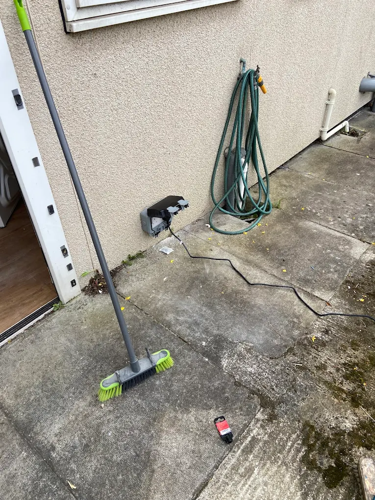 Weatherproof outdoor power socket installed on Bristol property exterior wall