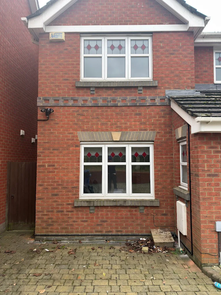 Exterior PIR security light installed on brick wall of Bristol home