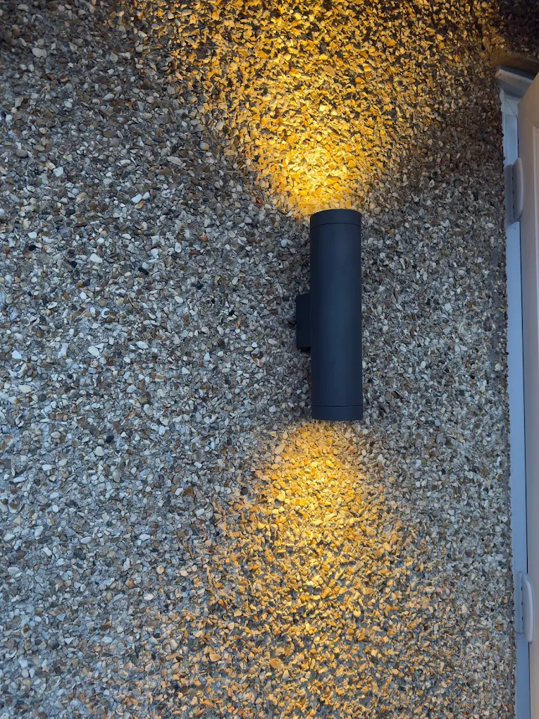 Exterior wall uplight casting light on stone wall of Bristol property